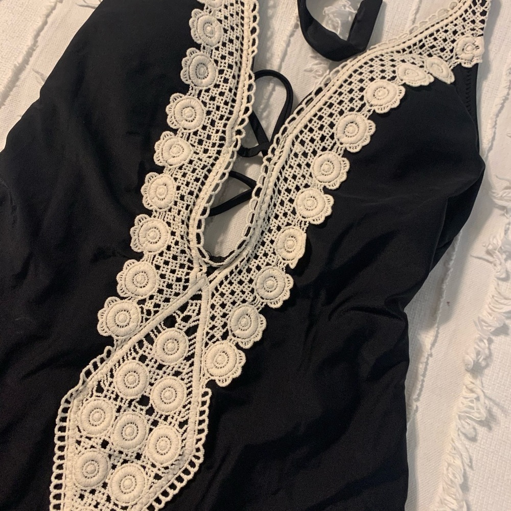 Black and lace one piece swimsuit NWT